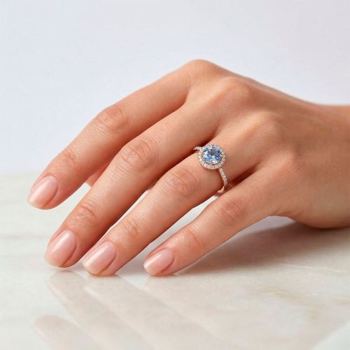 Rose gold ring with 0.13 carat blue sapphire and 0.55 carat diamonds
