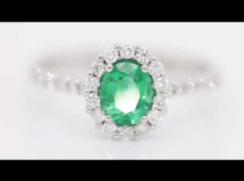 White gold ring with diamonds 0.35 carats and emerald 0.59 carats