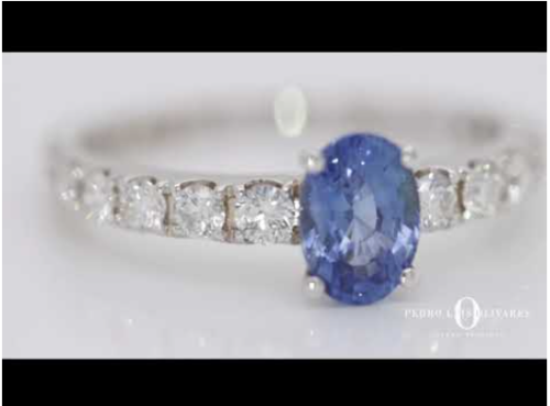 White gold ring with diamonds and sapphire