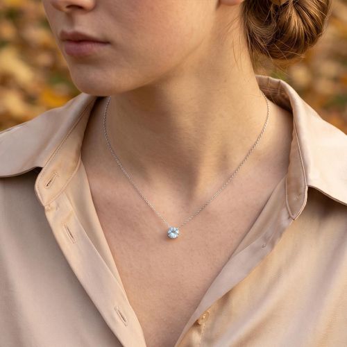 White gold necklace with blue topaz